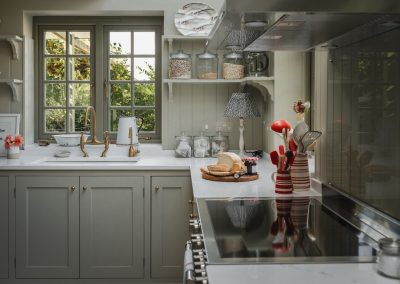Kitchen sink area with aged brass Perrin & Rowe taps
